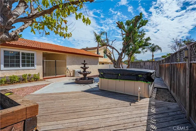 a view of a room with wooden floor and windows