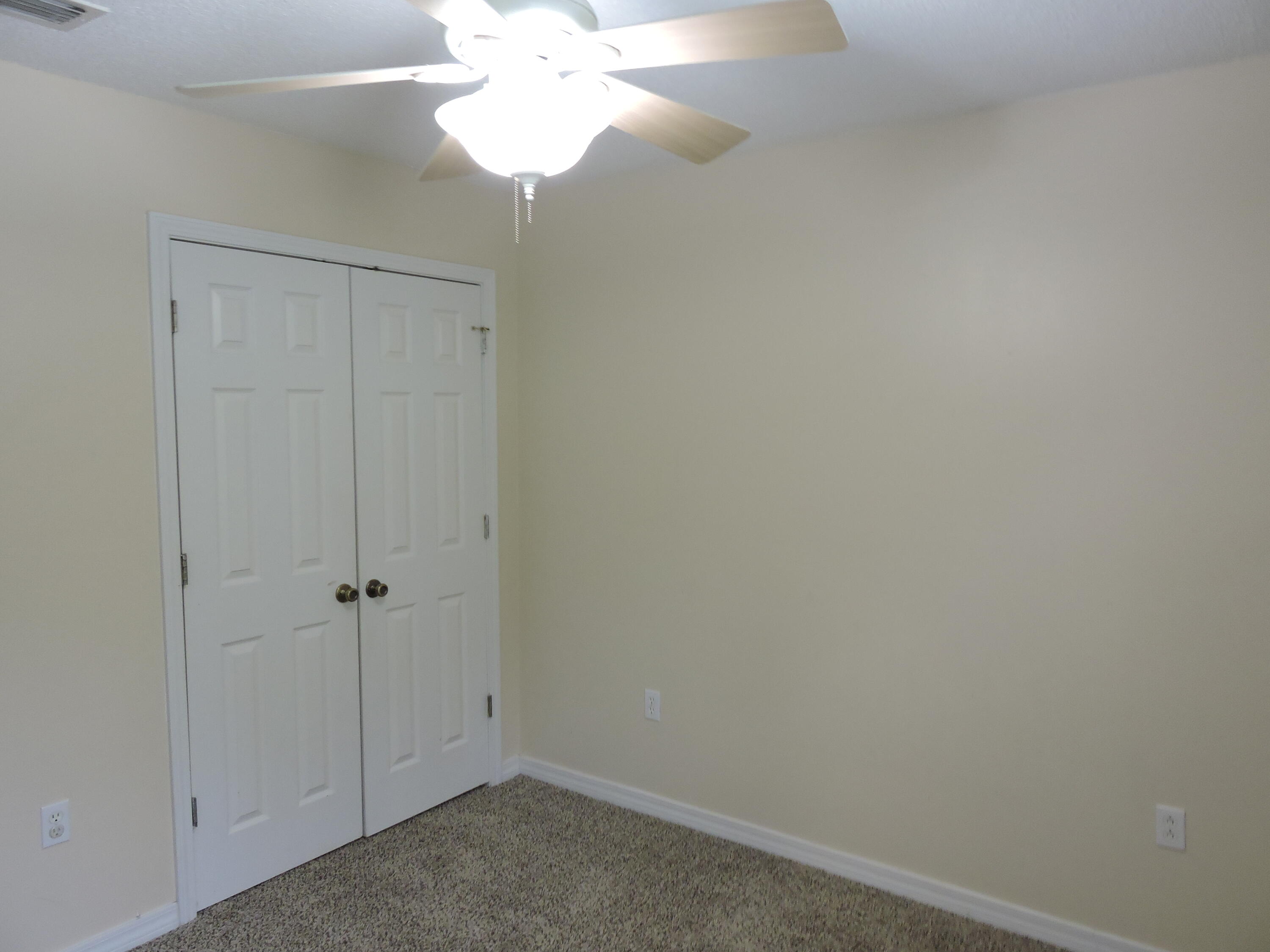 178 Cabana Way Crestview, FL 32536 - Photo 15 of 20 an empty room with a chandelier fan