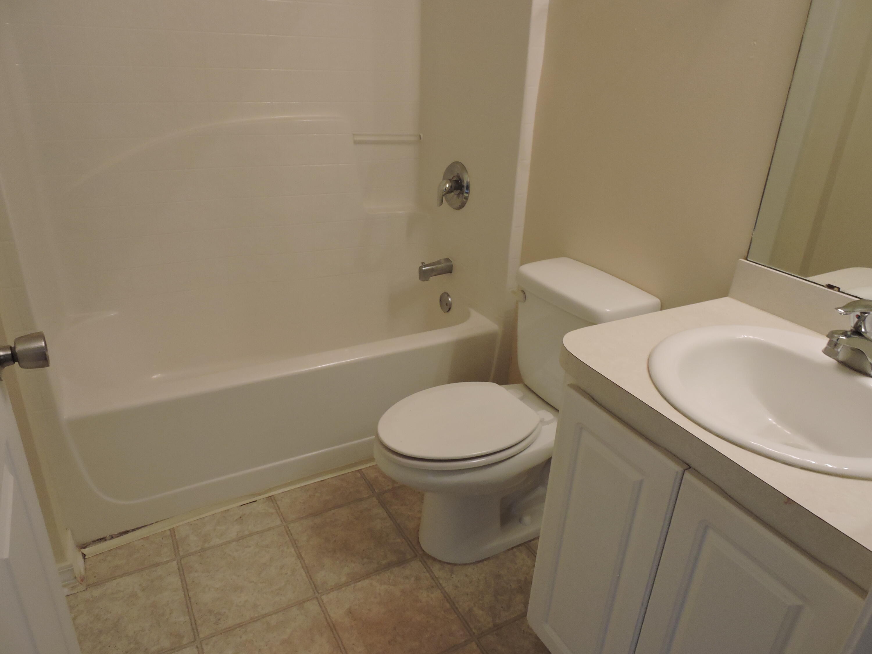178 Cabana Way Crestview, FL 32536 - Photo 18 of 20 a white toilet sitting next to a bath tub