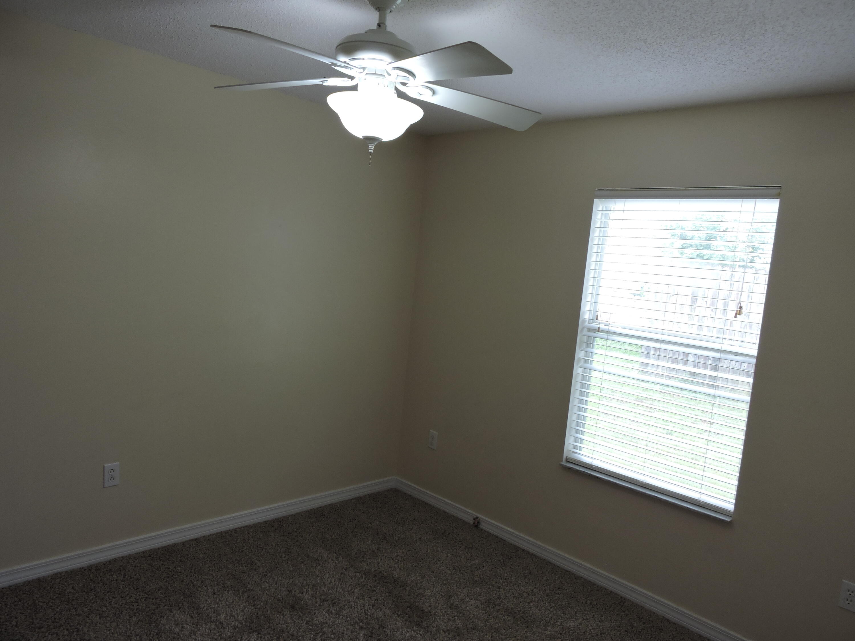 178 Cabana Way Crestview, FL 32536 - Photo 19 of 20 an empty room with a window