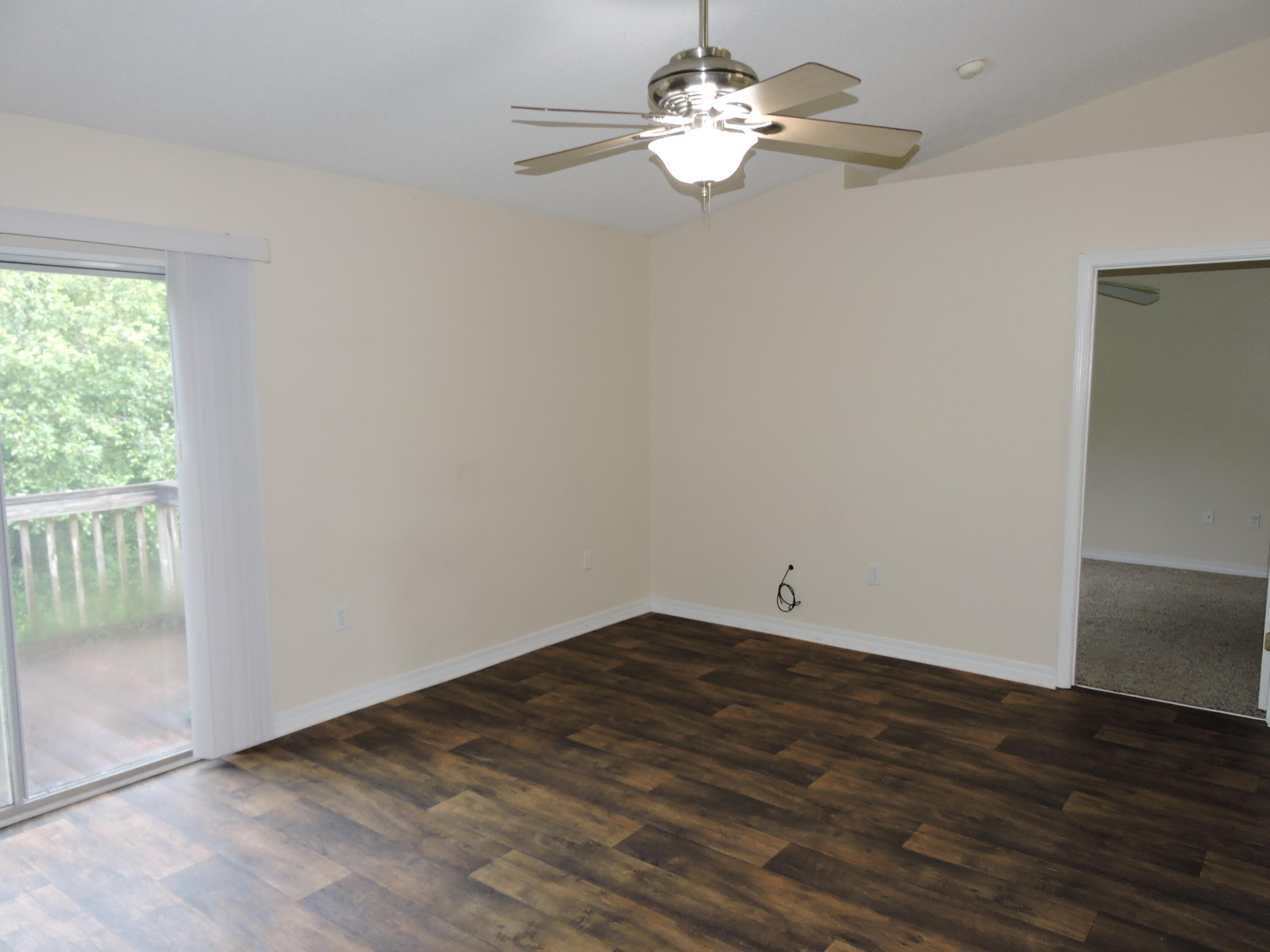 178 Cabana Way Crestview, FL 32536 - Photo 7 of 20 a view of empty room with wooden floor and fan