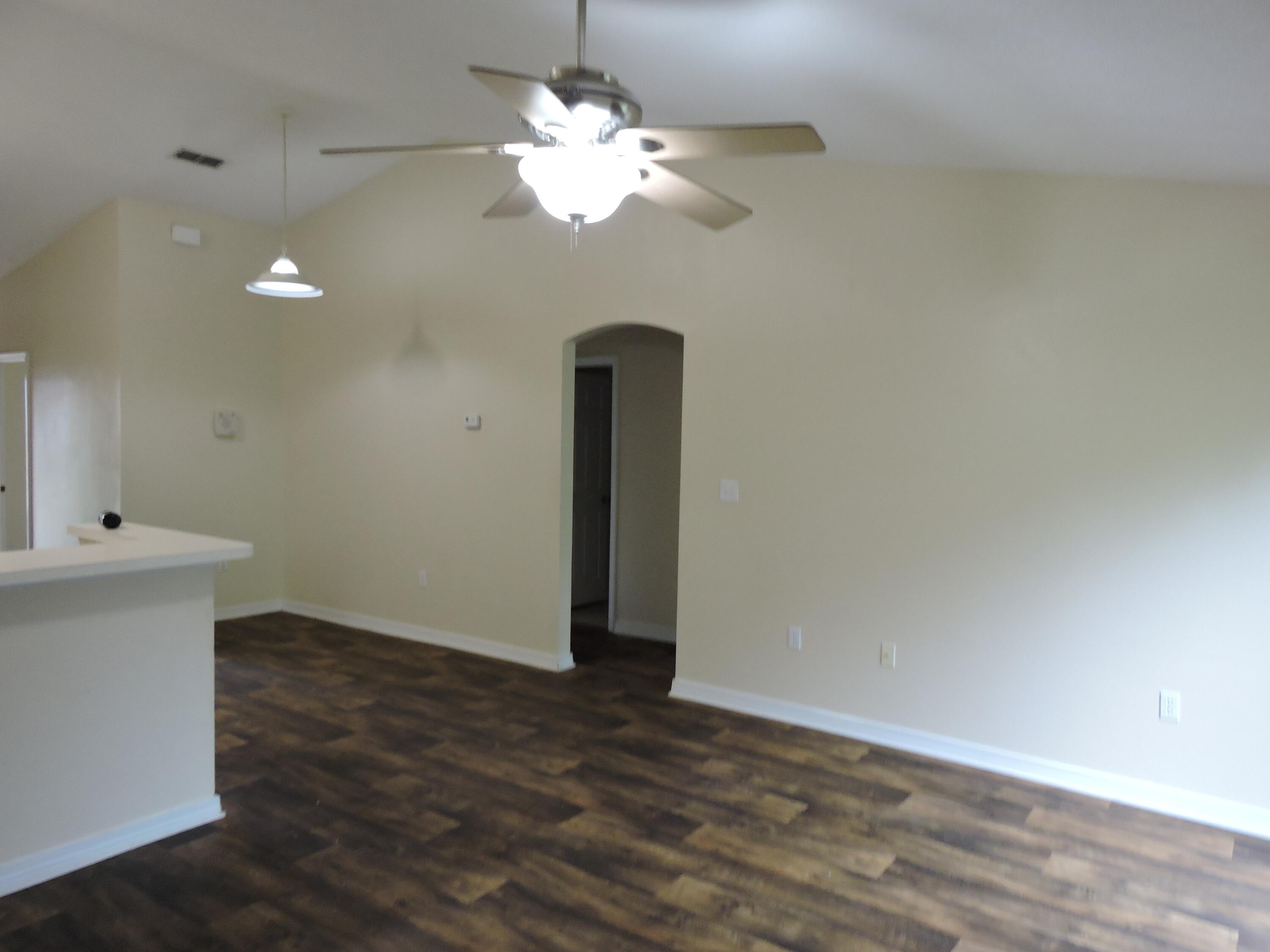 178 Cabana Way Crestview, FL 32536 - Photo 8 of 20 wooden floor in an empty room with a window