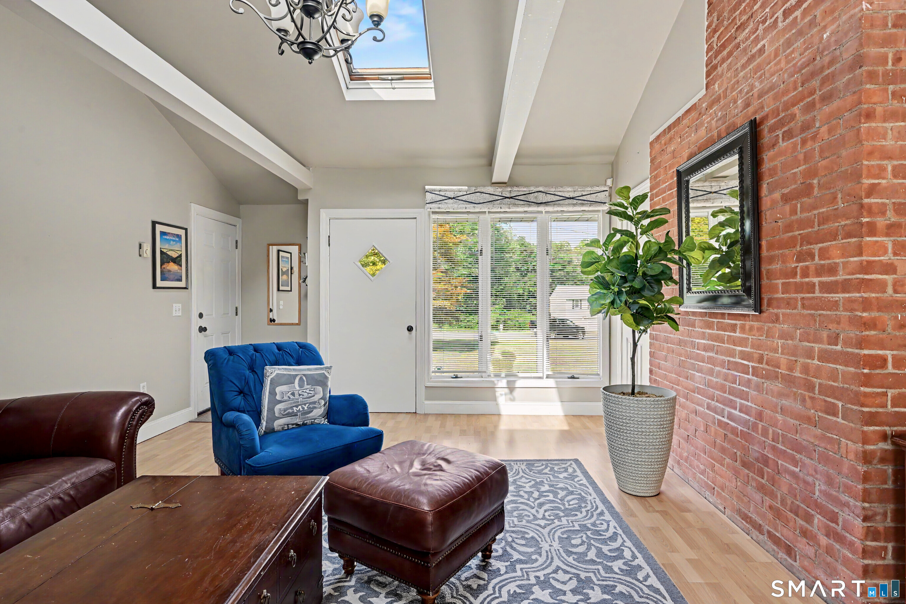 524 Ferry Road Orange, CT 06477 - Photo 17 of 40 a living room with furniture and a potted plant