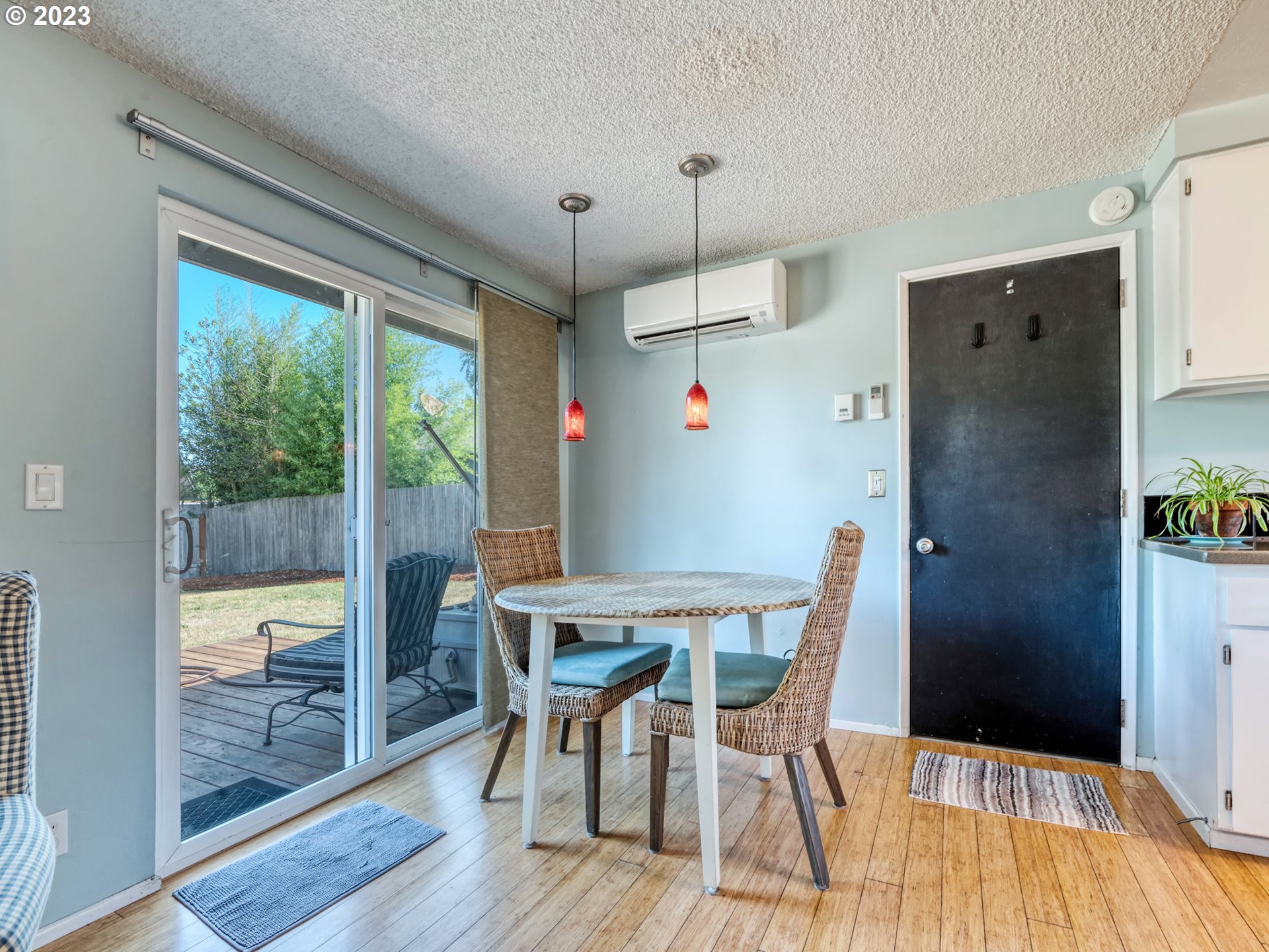 636 Island Street Springfield, OR 97477 - Photo 13 of 25 a view of a dining room with furniture a chandelier and wooden floor