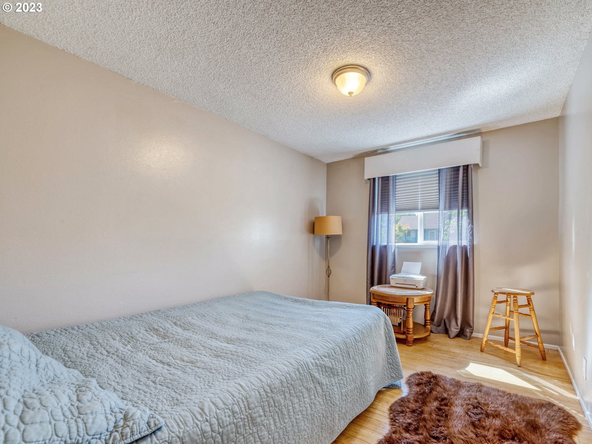 636 Island Street Springfield, OR 97477 - Photo 19 of 25 a bedroom with a bed and a window