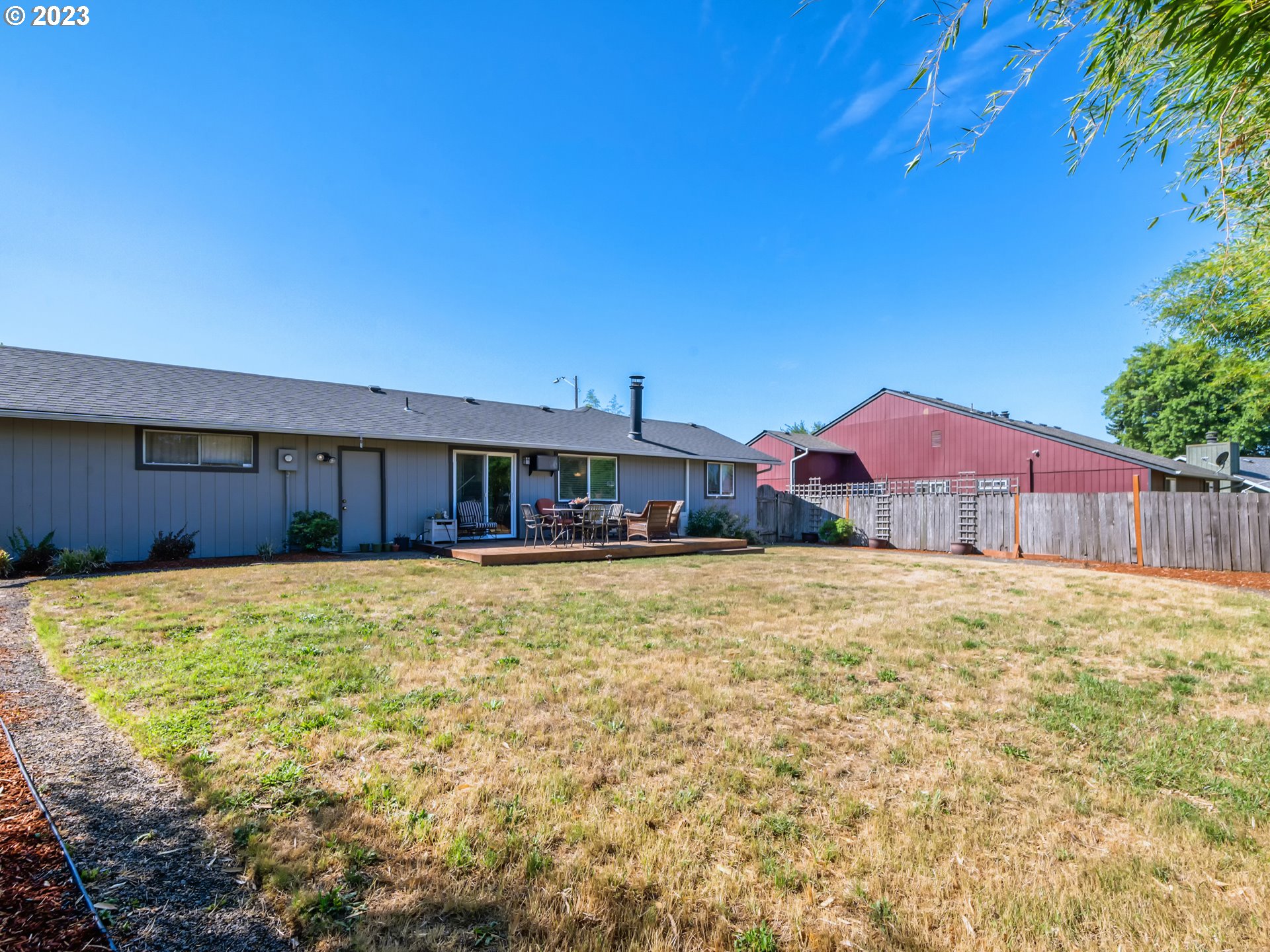 636 Island Street Springfield, OR 97477 - Photo 23 of 25 a swimming pool with wooden fence