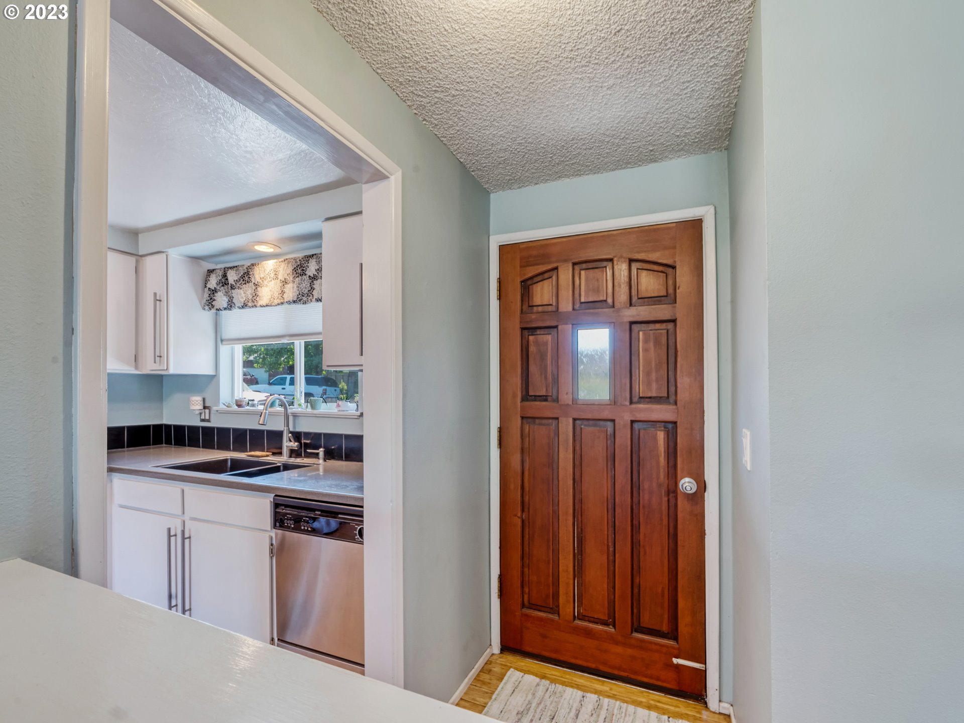 636 Island Street Springfield, OR 97477 - Photo 3 of 25 a kitchen with a refrigerator and a stove top oven