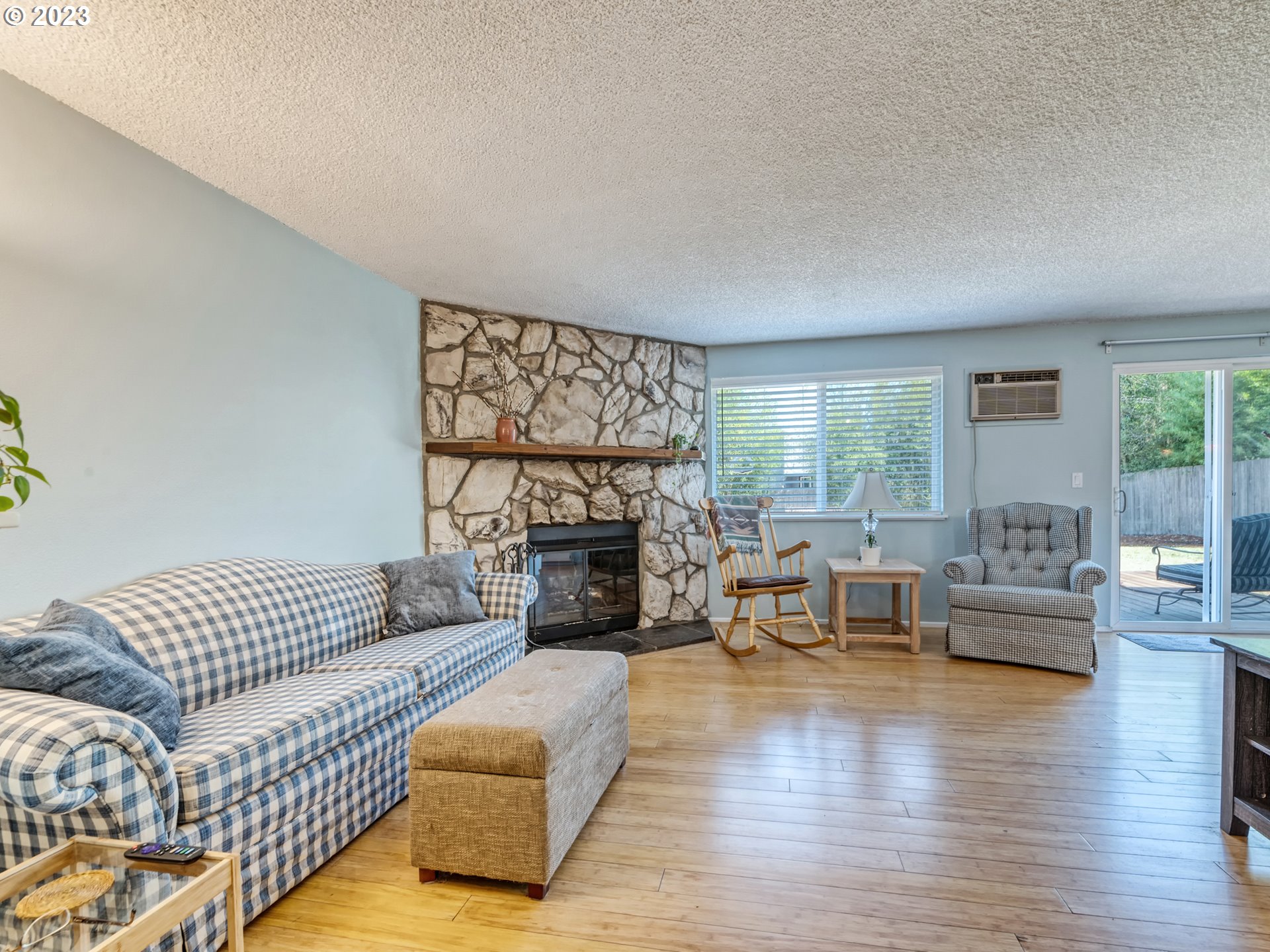 636 Island Street Springfield, OR 97477 - Photo 4 of 25 a living room with furniture or couch and a fireplace
