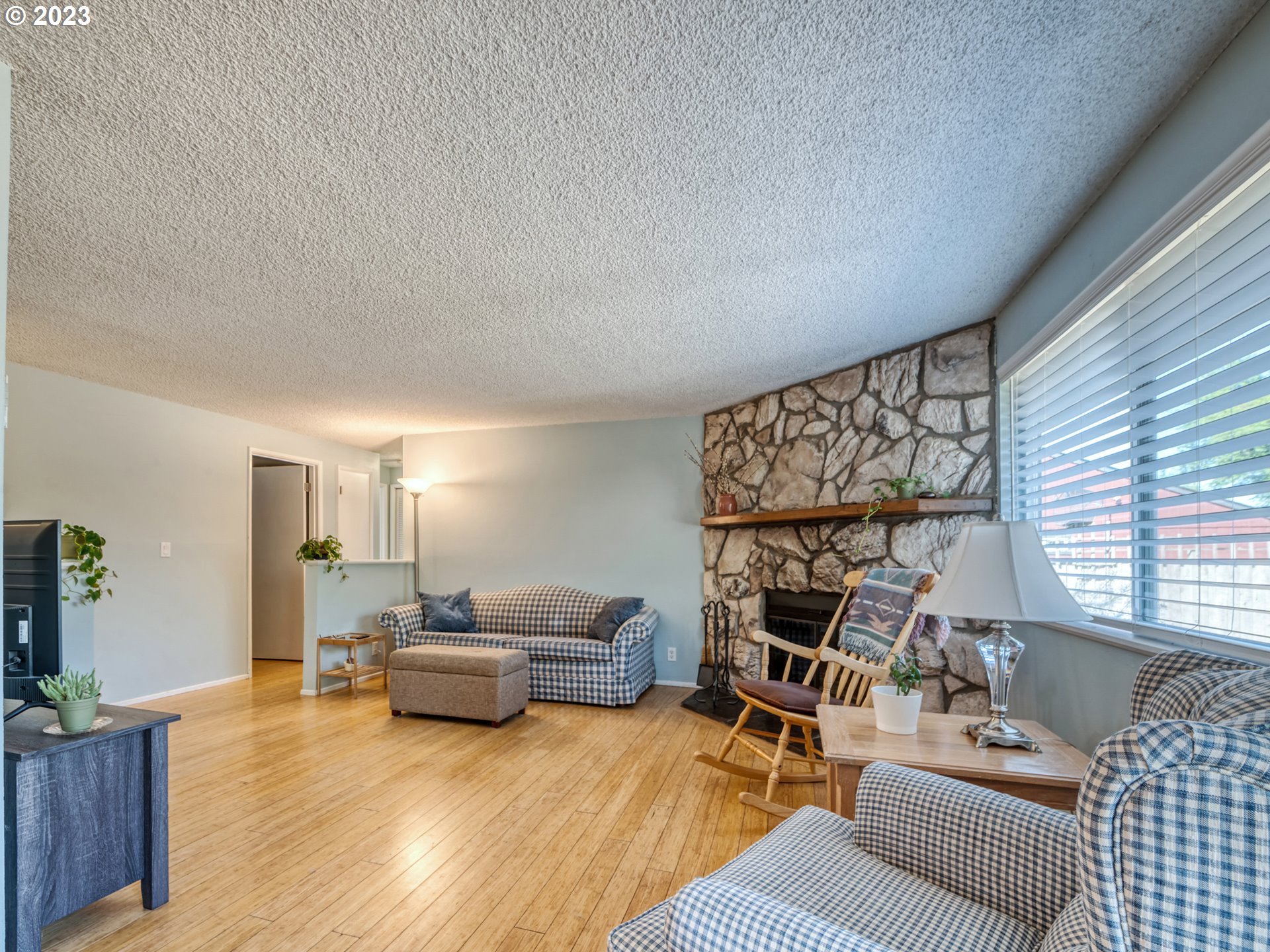 636 Island Street Springfield, OR 97477 - Photo 6 of 25 a living room with furniture and a wooden floor