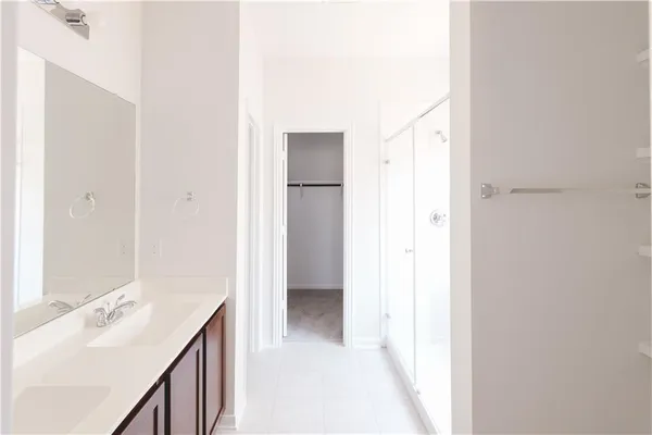 a view of a hallway with a bathroom