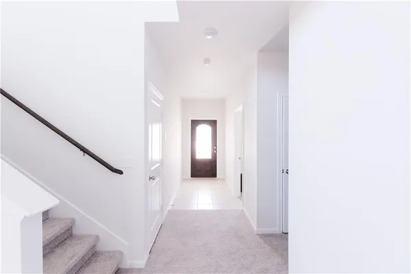 a view of a hallway with a white walls