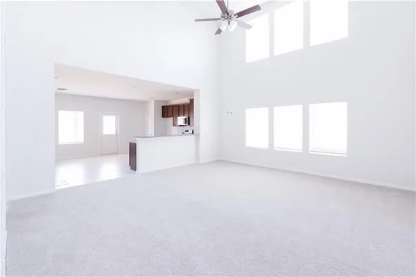 an empty room with a empty space and windows