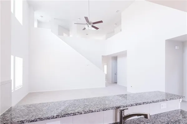 a view of a hallway with a chandelier