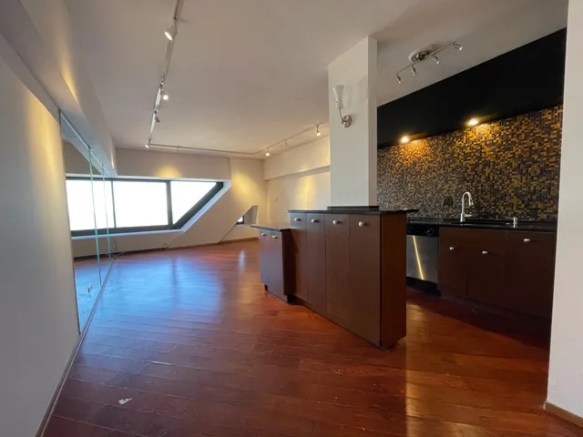 a kitchen with a sink and a refrigerator