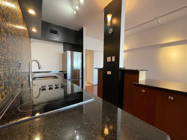 a kitchen with stainless steel appliances a refrigerator and a sink