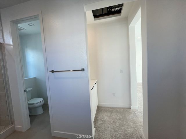a view of an ocean with boats and palm trees