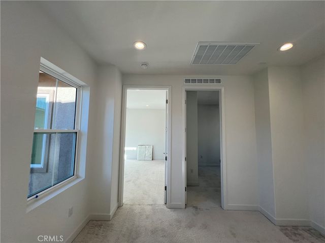 a view of a hallway view with staircase