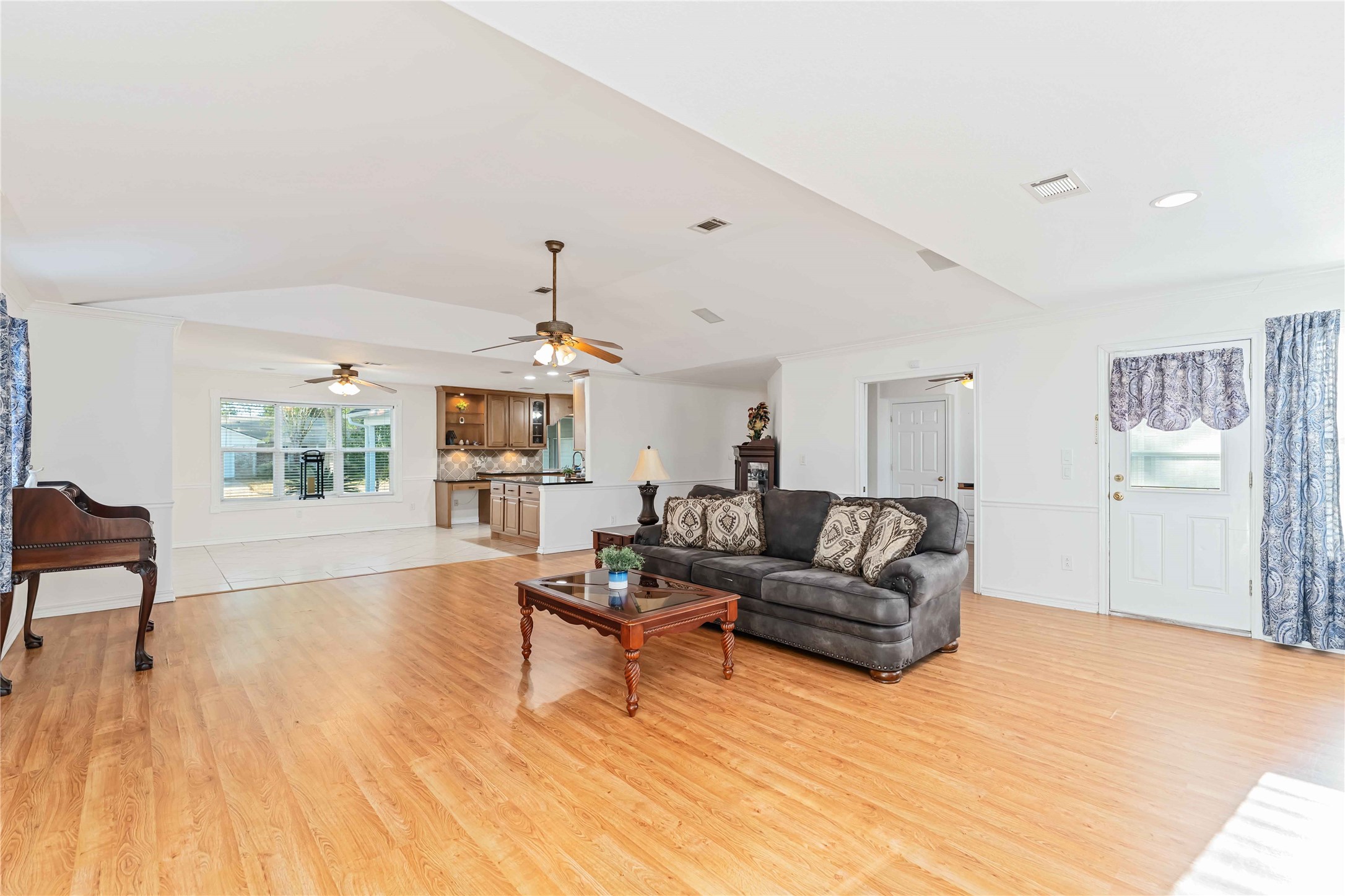606 Packer Court Webster, TX 77598 - Photo 20 of 28 a living room with furniture and a wooden floor