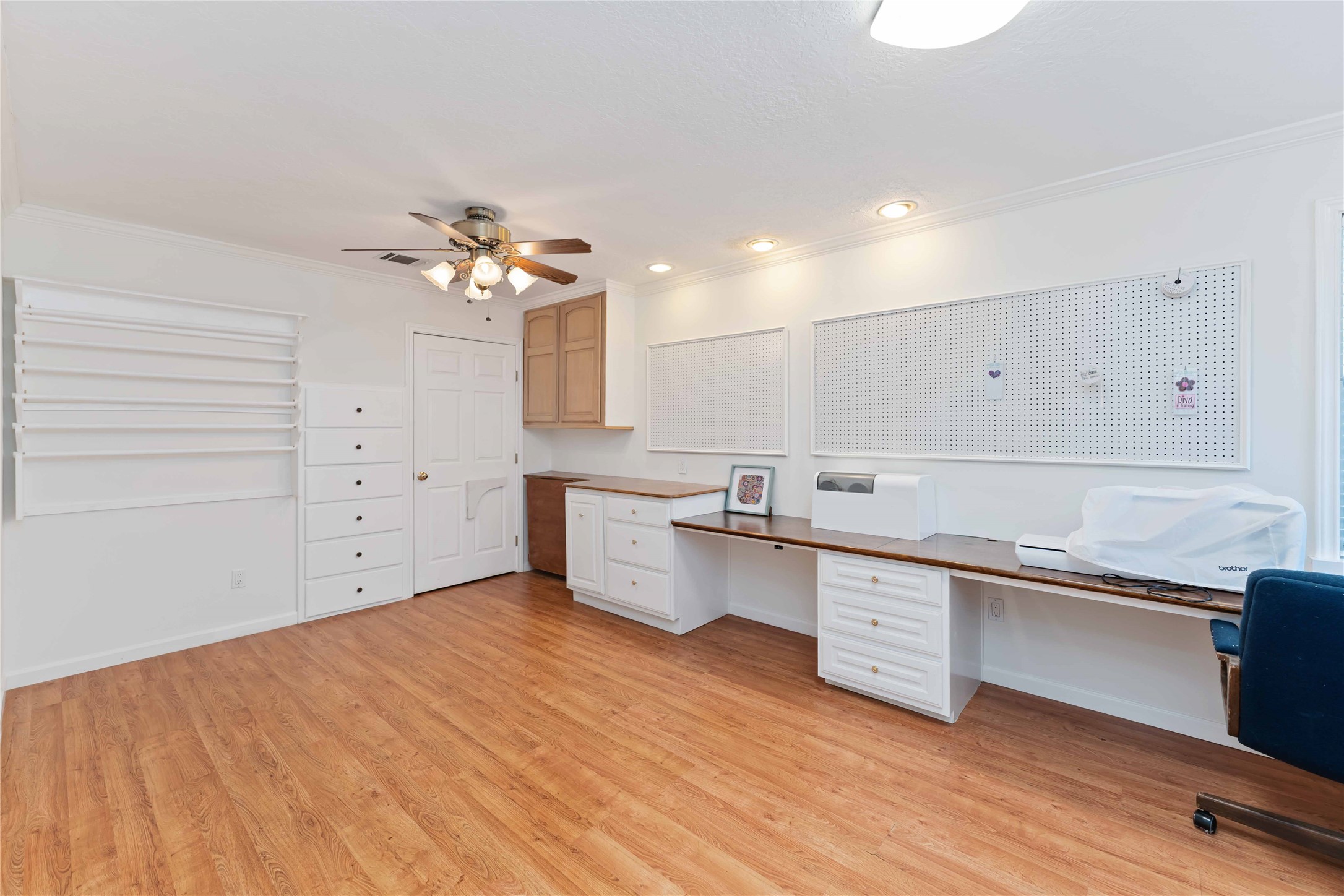 606 Packer Court Webster, TX 77598 - Photo 9 of 28 a large white kitchen with a sink dishwasher a stove and a refrigerator with wooden floor