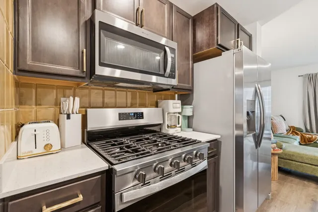 a kitchen with a stove and a microwave