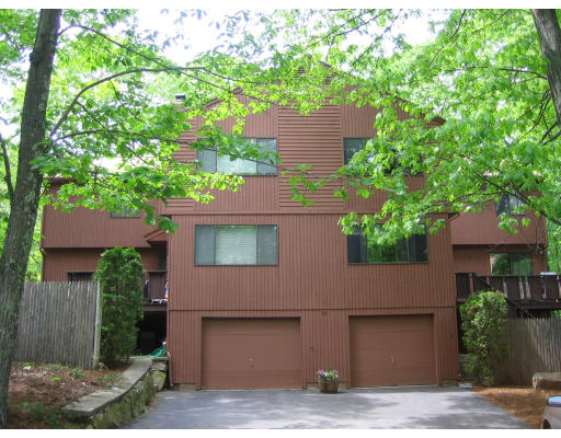 88 Mountain Gate Road, Unit 88 Ashland, MA 01721 - Photo 1 of 1 a front view of a house with a garden