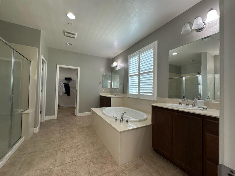 1749 Ettle Street Manteca, CA 95337 - Photo 9 of 12 a large bathroom with a large tub and sink