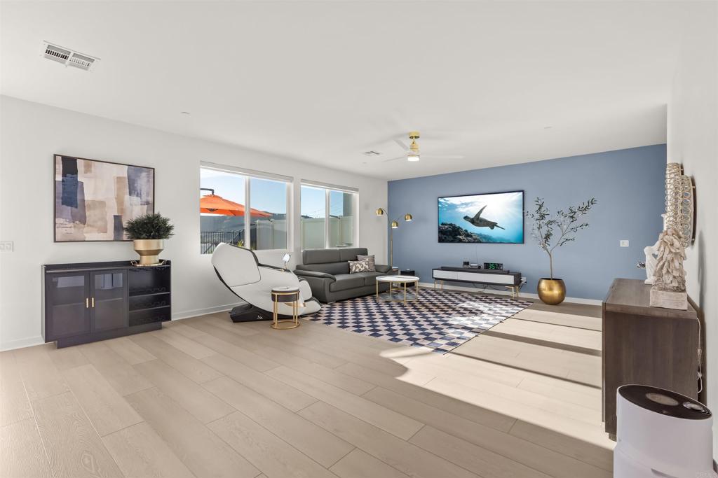 550 Meadowood Street Fallbrook, CA 92028 - Photo 15 of 37 a living room with furniture and a flat screen tv