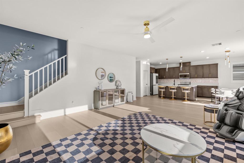550 Meadowood Street Fallbrook, CA 92028 - Photo 16 of 37 a living room with furniture a dining table and kitchen view