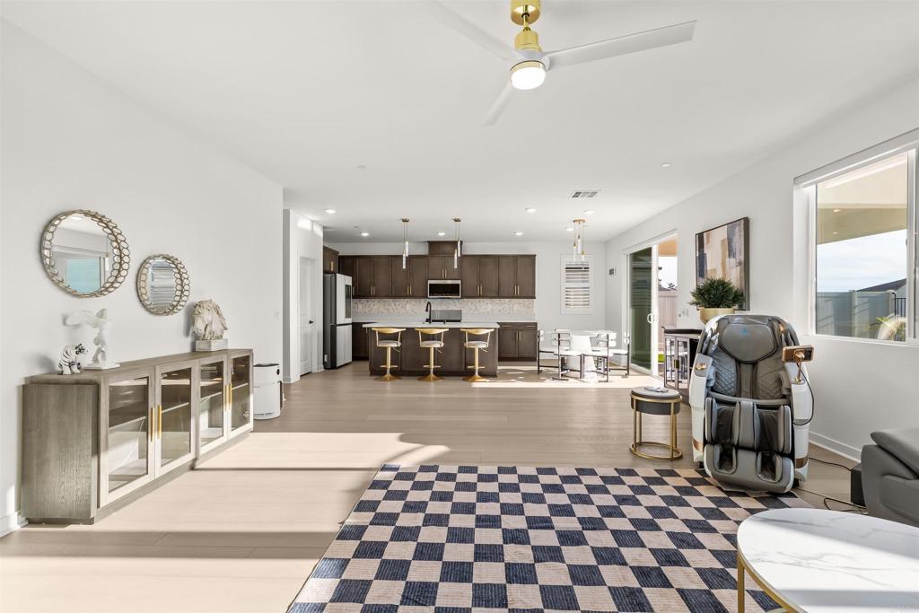 550 Meadowood Street Fallbrook, CA 92028 - Photo 17 of 37 a room with furniture a rug and white walls