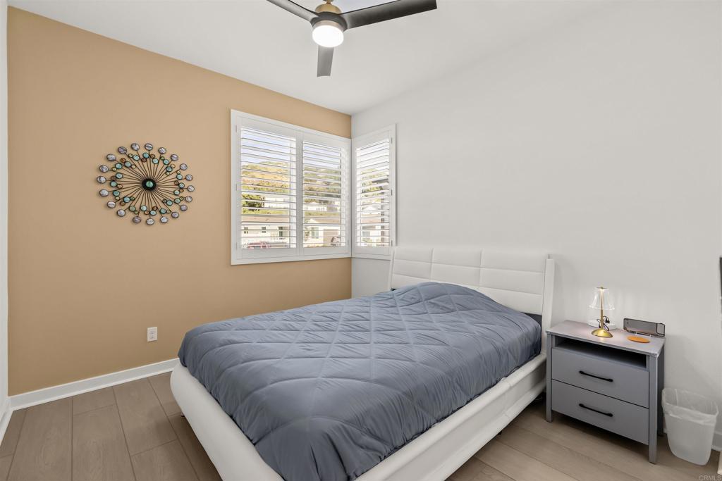 550 Meadowood Street Fallbrook, CA 92028 - Photo 23 of 37 a bedroom with a bed and a window