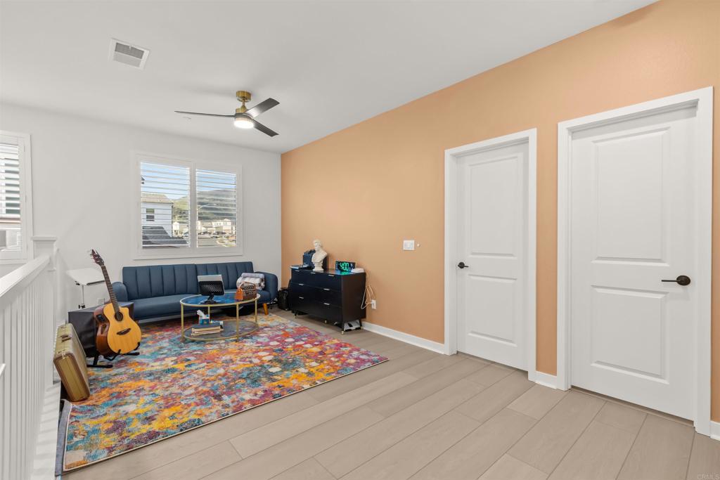 550 Meadowood Street Fallbrook, CA 92028 - Photo 24 of 37 a bed room with a bed and a window