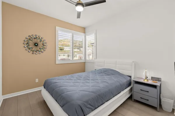 a bed room with furniture and a window