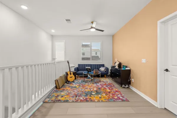 a living room with furniture a window and a yard