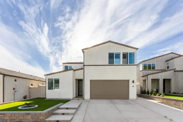 a view of a chairs and table on the roof
