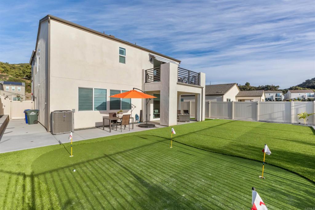 550 Meadowood Street Fallbrook, CA 92028 - Photo 32 of 37 a view of a house with backyard porch and sitting area