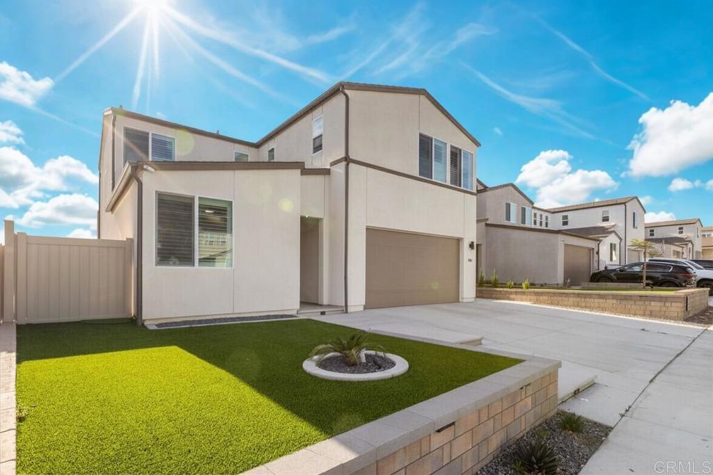 550 Meadowood Street Fallbrook, CA 92028 - Photo 33 of 37 a view of a white house with a swimming pool