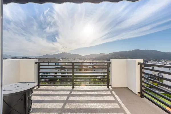 a large kitchen with kitchen island a sink table and chairs