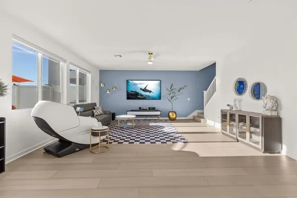 a large kitchen with a table and chairs