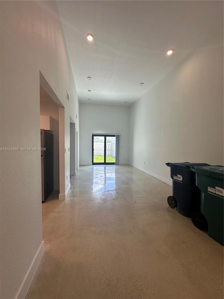 23935 Southwest 110th Court, Unit 23935 Homestead, FL 33032 - Photo 3 of 10 a view of a livingroom with a workspace