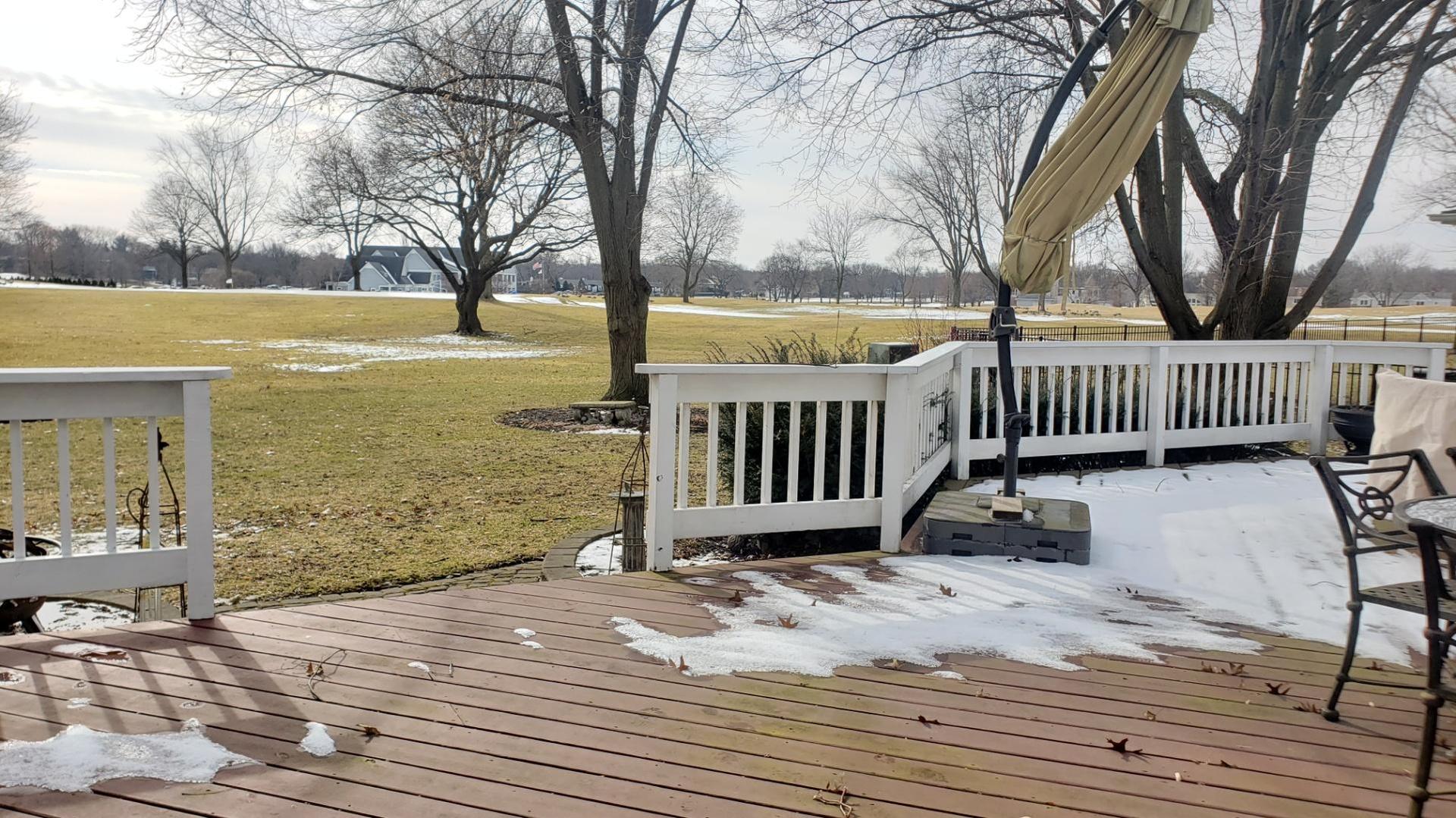 822 West Bauer Road Naperville, IL 60563 - Photo 2 of 3 a view of a deck with a chair and floor to ceiling window