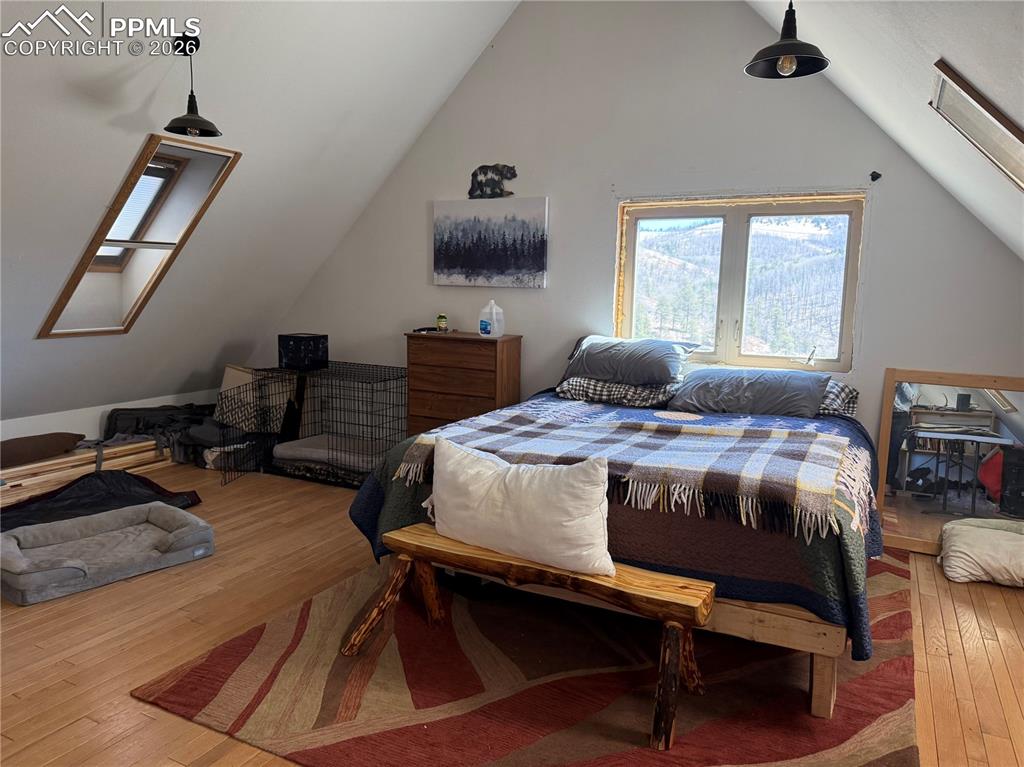 450 Schierl Road Fort Garland, CO 81133 - Photo 38 of 40 a bedroom with a bed a table and chair