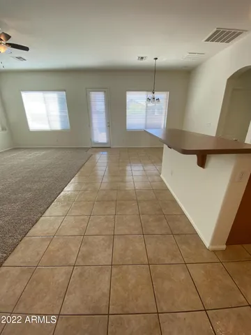a view of a livingroom with an empty space and window