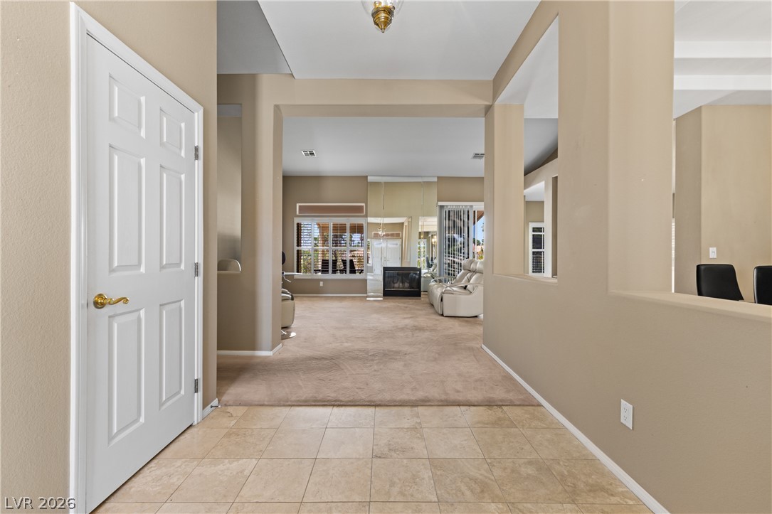 649 Rancho Circle Mesquite, NV 89027 - Photo 11 of 73 Step into this inviting home, where tiled entry flows into a carpeted living space with a fireplace.