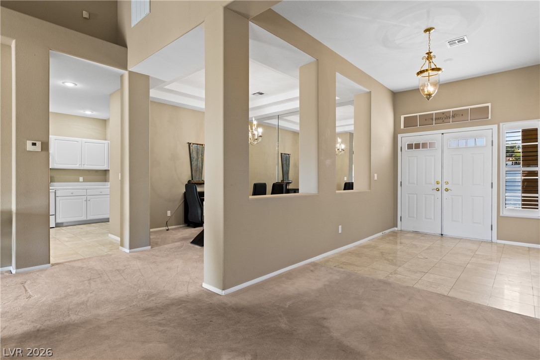 649 Rancho Circle Mesquite, NV 89027 - Photo 12 of 73 The bright entry area features elegant flooring and leads into inviting interior spaces.