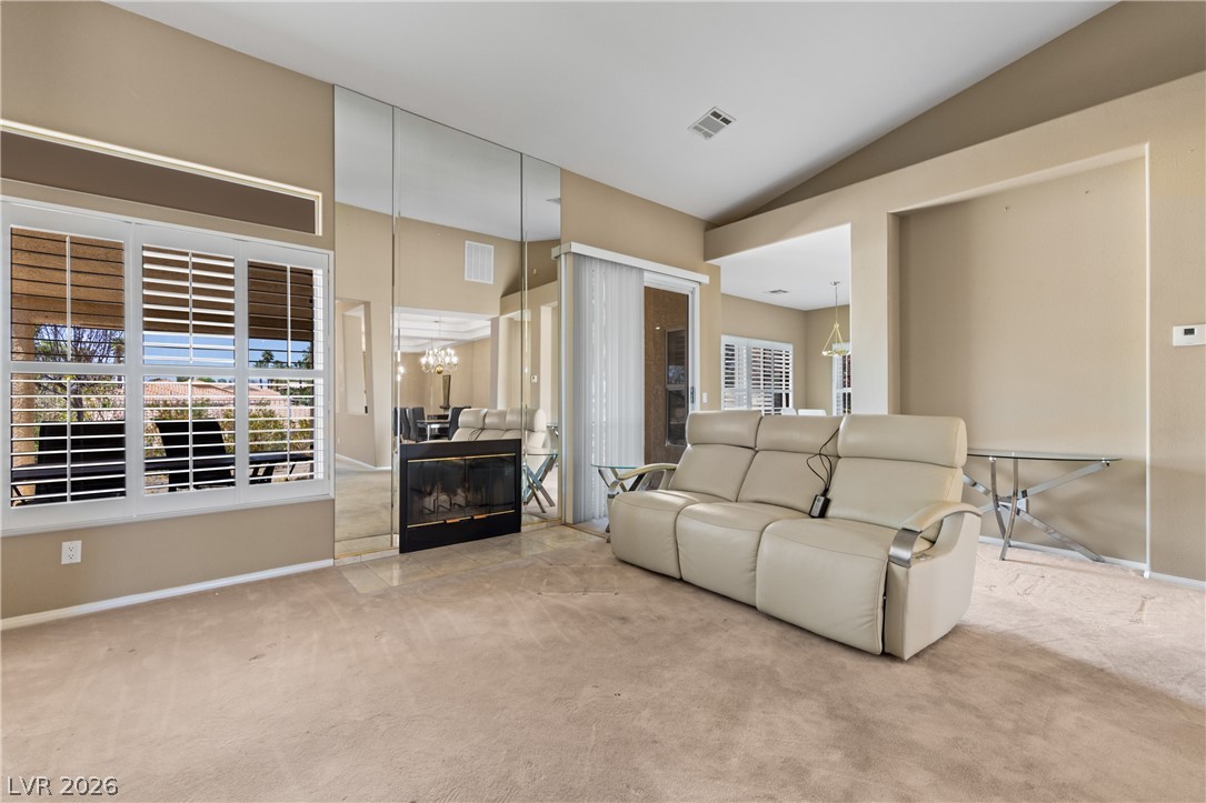 649 Rancho Circle Mesquite, NV 89027 - Photo 15 of 73 This bright living area features vaulted ceilings and ample natural light through well-appointed windows.