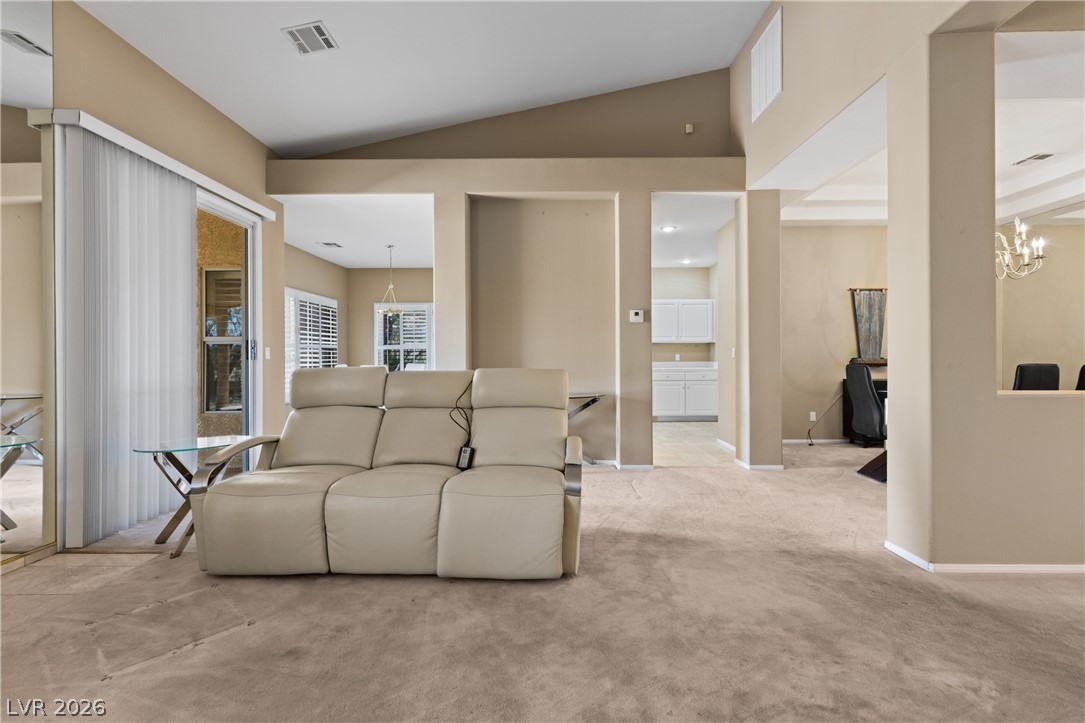 649 Rancho Circle Mesquite, NV 89027 - Photo 17 of 73 This inviting living space features high ceilings and soft carpeting, perfect for comfortable daily living.