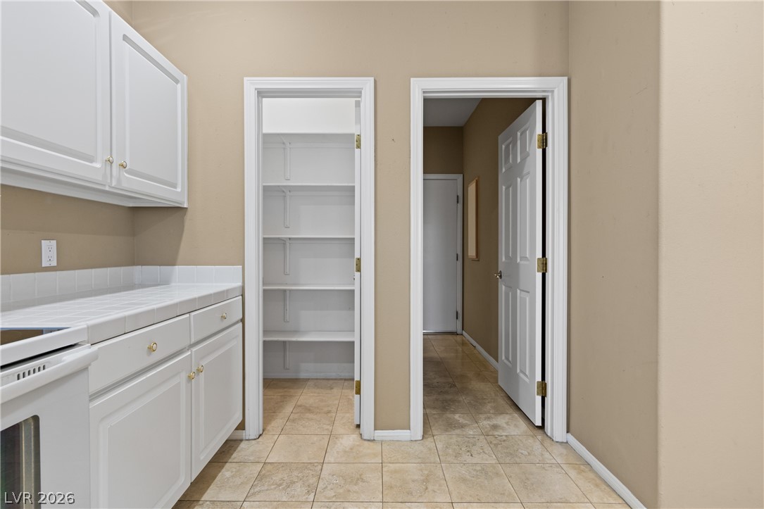 649 Rancho Circle Mesquite, NV 89027 - Photo 24 of 73 This functional kitchen features ample cabinet storage and convenient access to a spacious pantry.