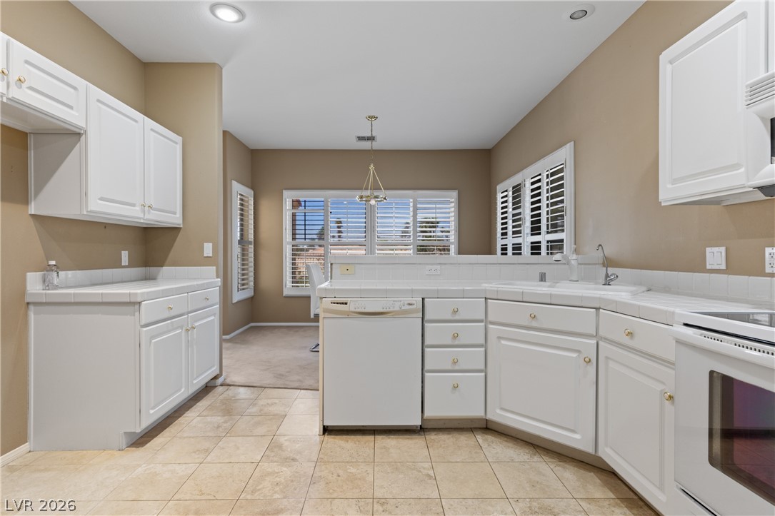 649 Rancho Circle Mesquite, NV 89027 - Photo 25 of 73 This spacious kitchen offers ample cabinetry, modern appliances, and a bright, inviting atmosphere.