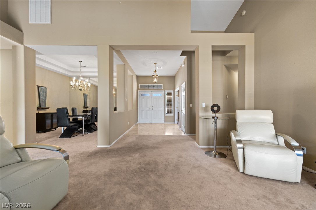 649 Rancho Circle Mesquite, NV 89027 - Photo 29 of 73 Step inside this home, where a spacious living area seamlessly transitions into an elegant dining room.