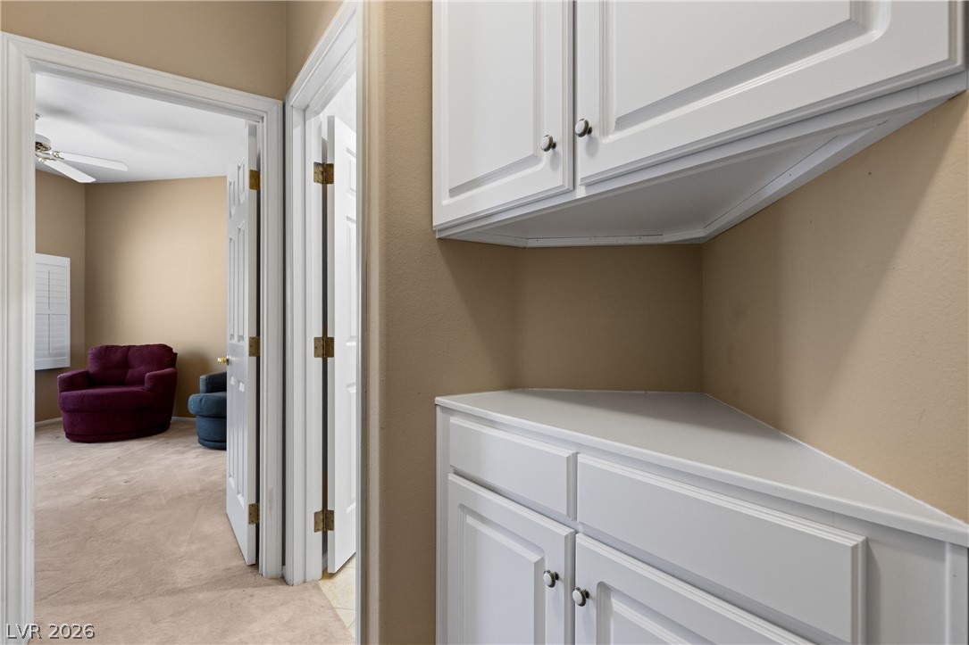 649 Rancho Circle Mesquite, NV 89027 - Photo 30 of 73 This interior hallway features functional cabinetry and leads into an adjacent room.